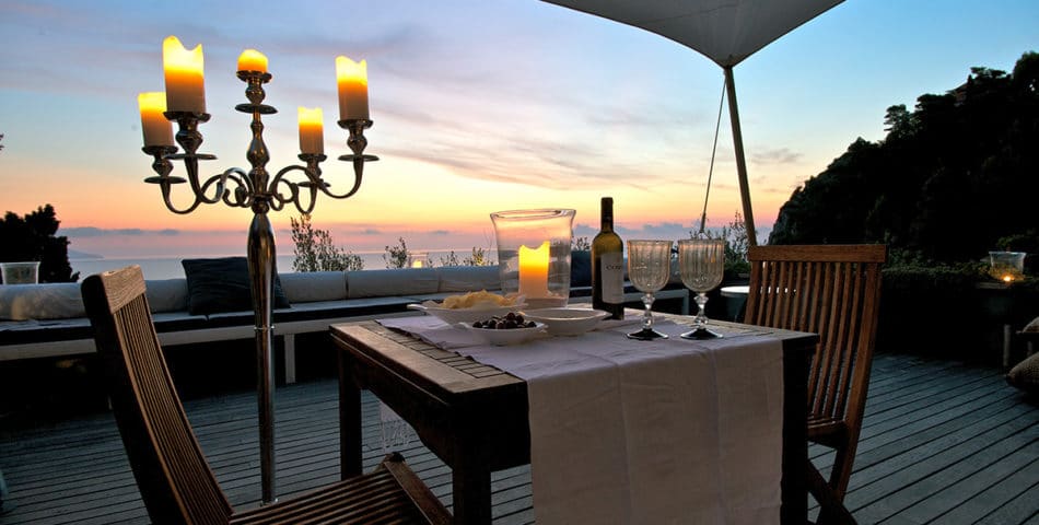 luxury villa outdoor dining overlooking the water