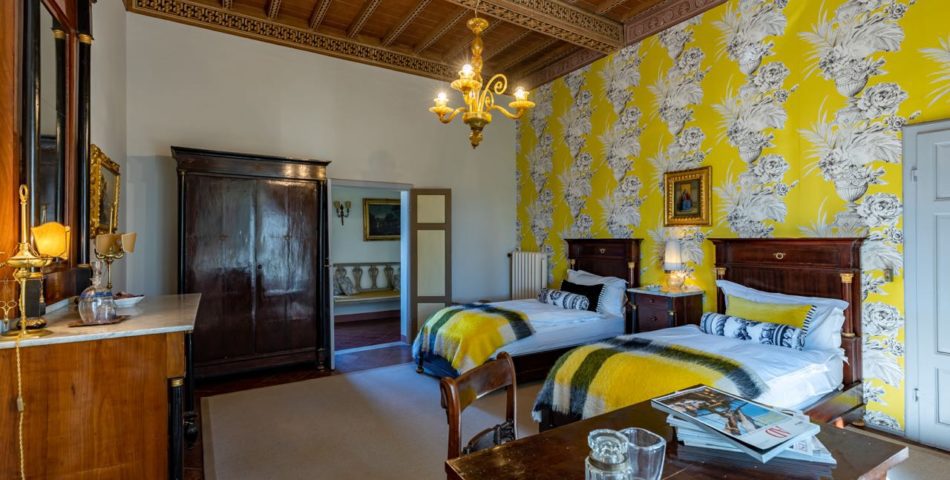villa in siena with spa and tennis court yellow bedroom