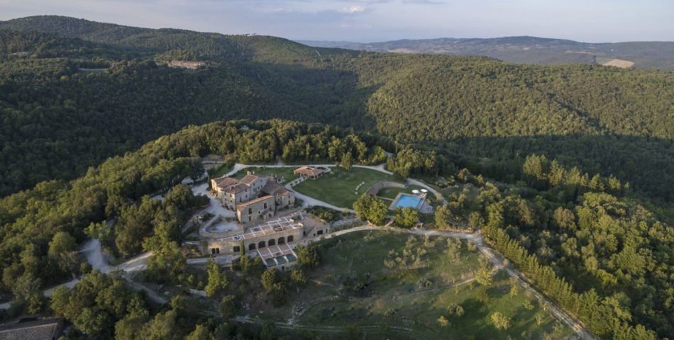 large sienna villa with horse aerial view